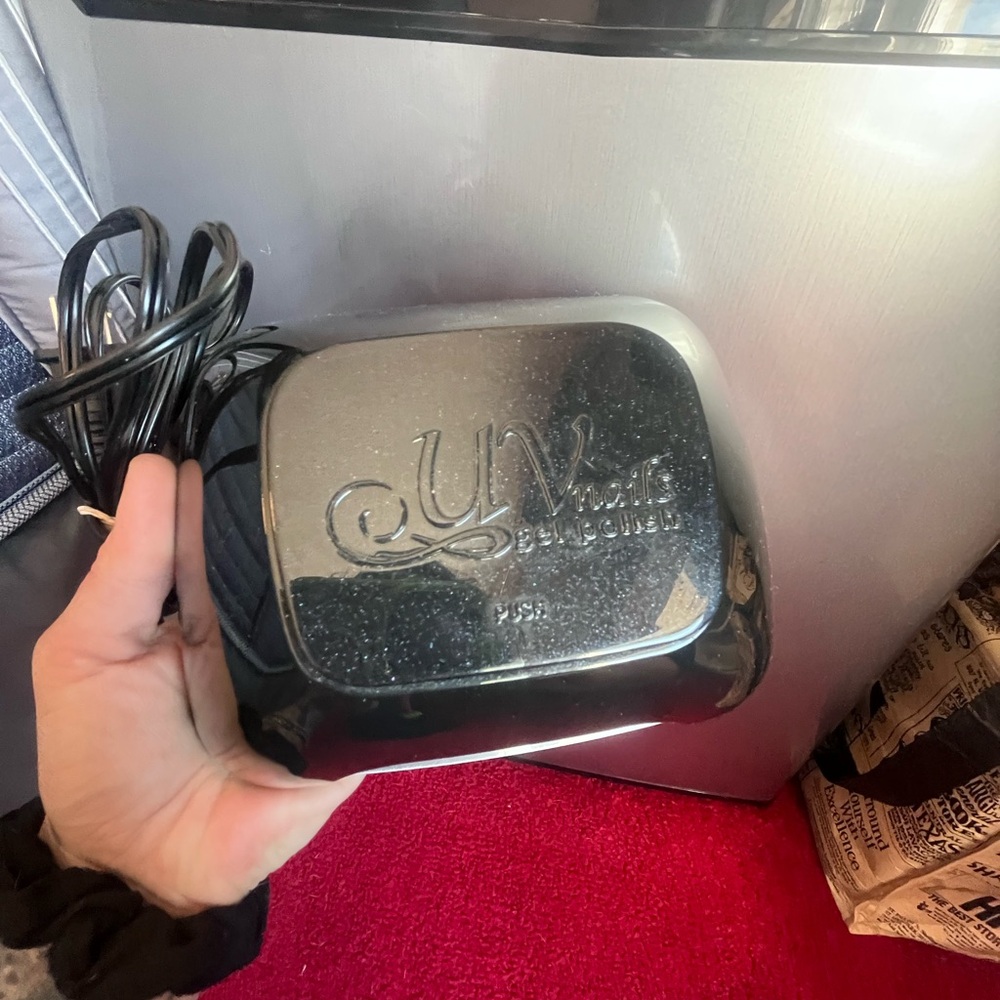 Black UV nail dryer. Perfect for quick drying.